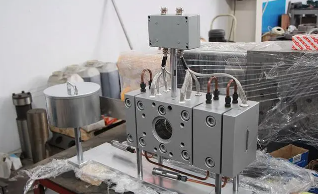 mesh belt screen changer for extruder